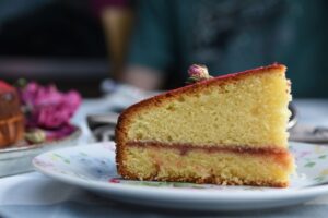 Slice of homemade Victoria sandwich cake | Professional Spanish translation services